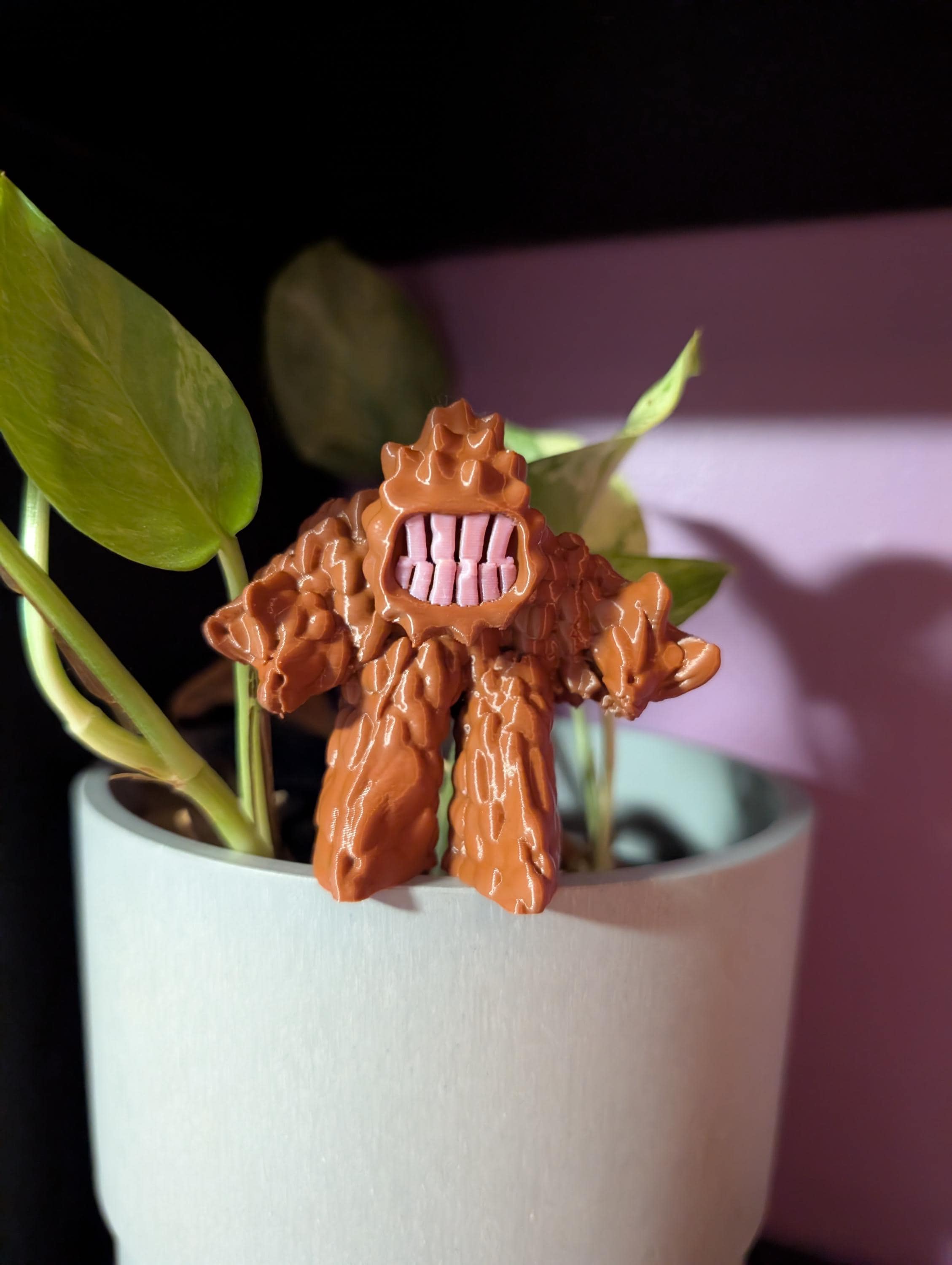 3D printed Mud Monster figurine with big teeth and bumpy body, cute but mischievous desk or shelf decor.