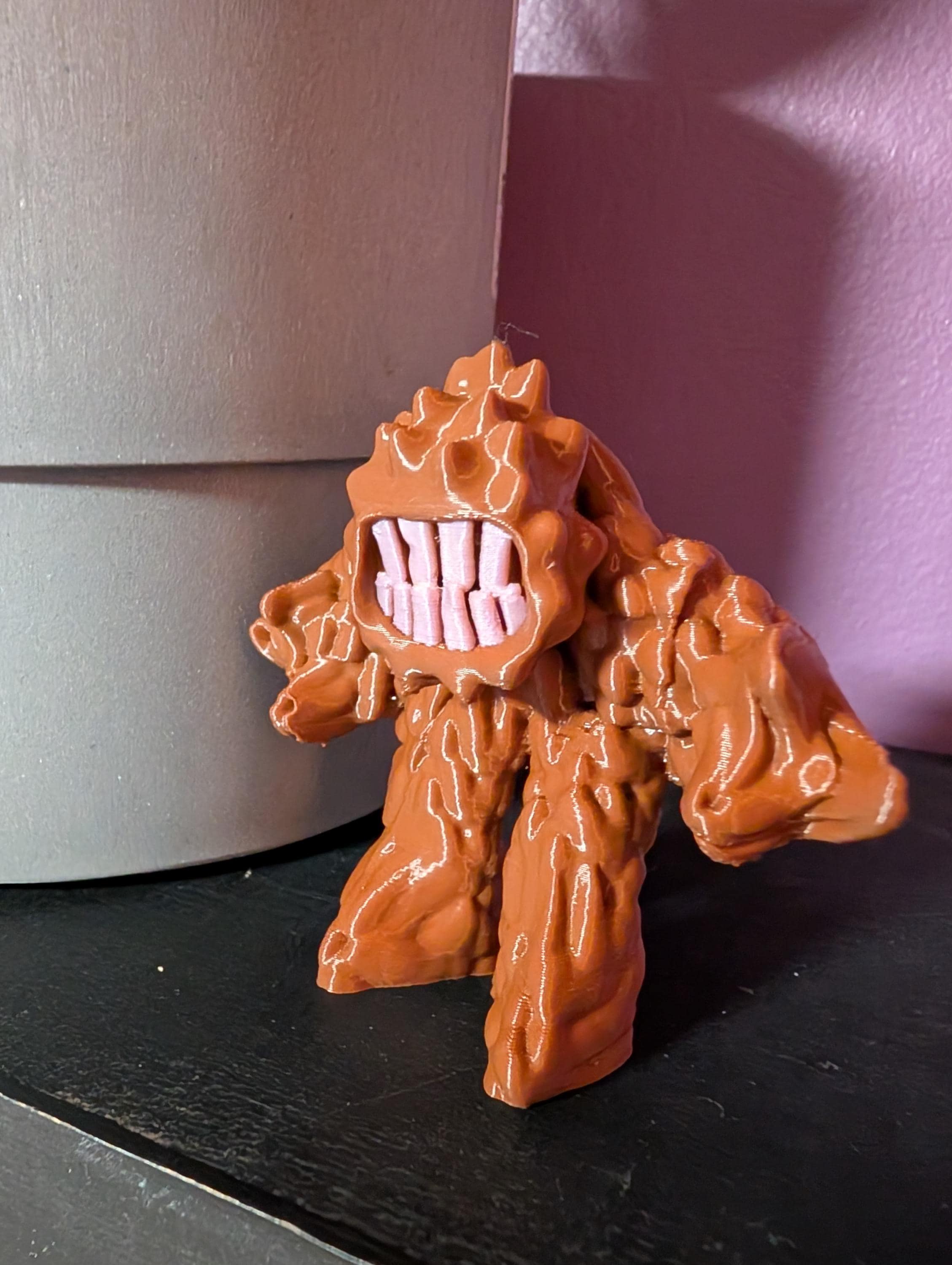 Trinket Mud Monster figurine with big teeth and bumpy body, cute but mischievous desk or shelf decor.